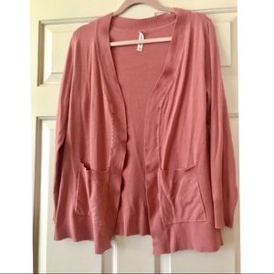 Pink cardigan in size medium.